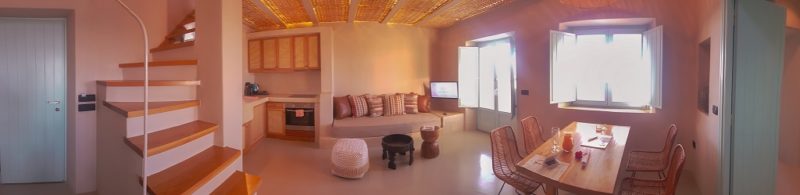 Panorama of the living room and the kitchen